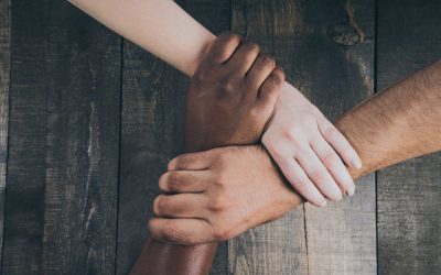 team-hands-linked-together